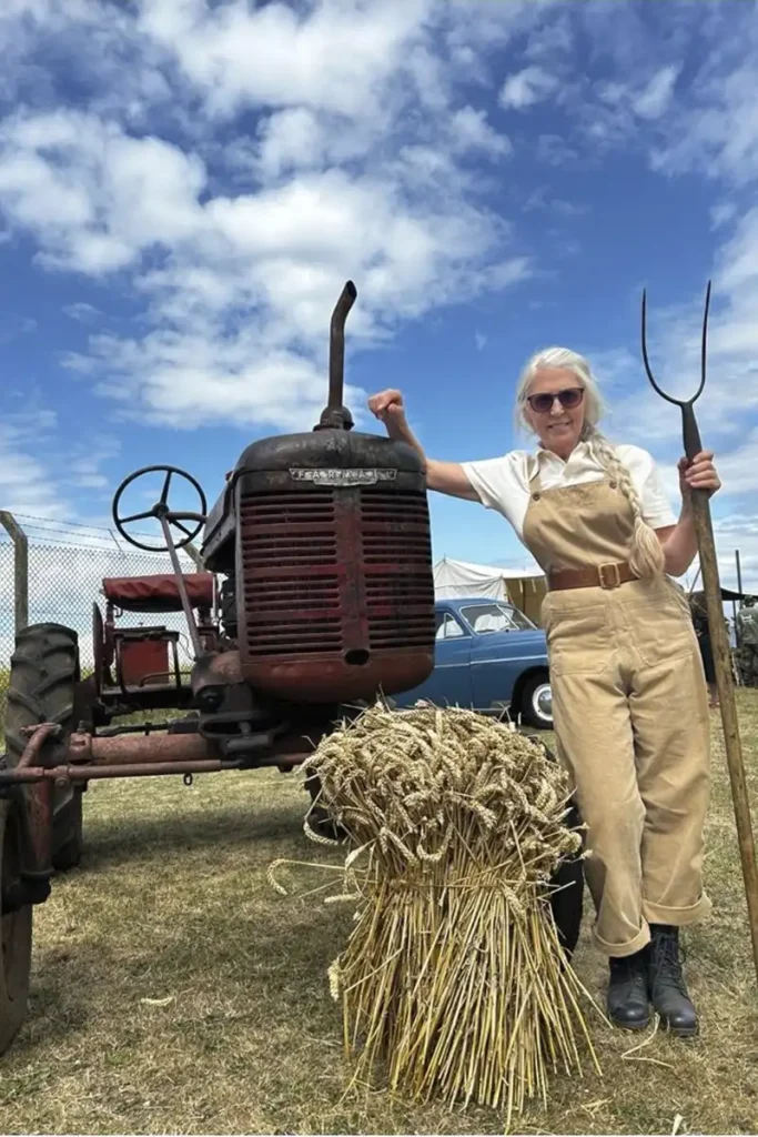 A member of the Suffolk Woman's Land Army with their tractor