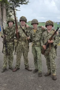 A group or reenactors dressed as World War 2 US Marines.